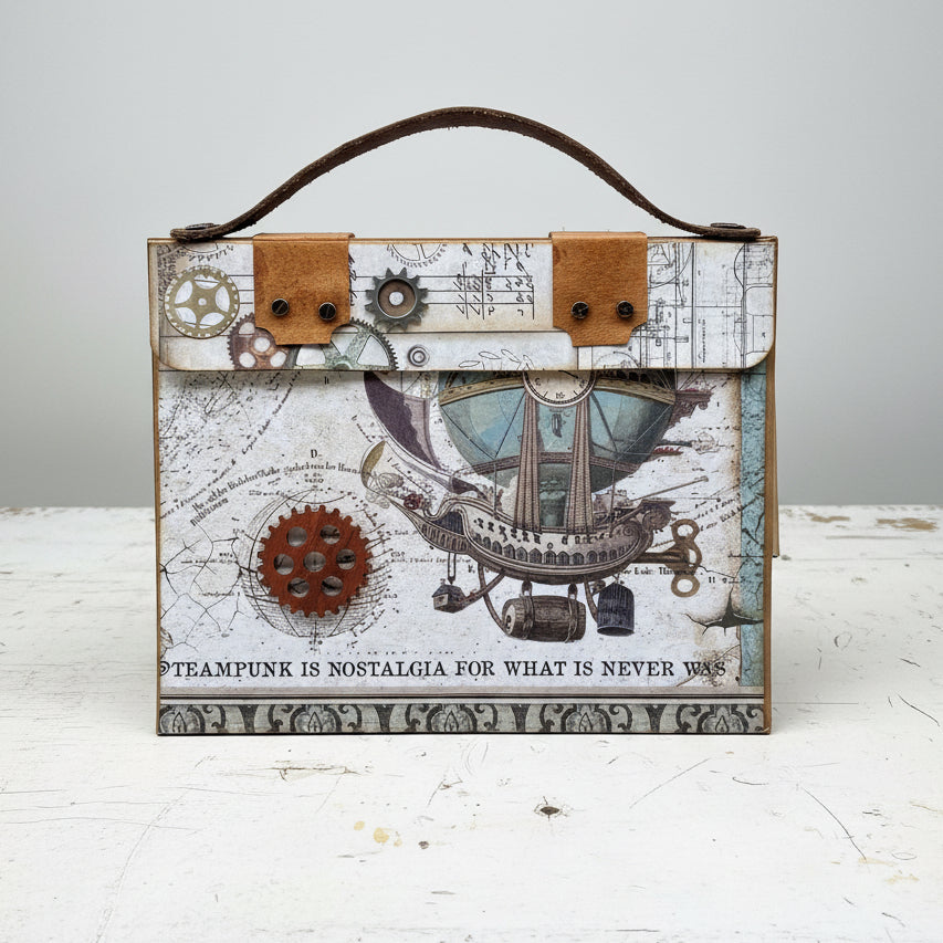 A mini album with a steampunk travel theme featuring a cover with a hot air balloon and gears, a leather handle, and a quote saying 'Steampunk is Nostalgia, For What Is Never Was'.